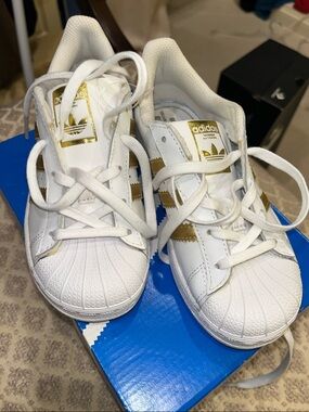 adidas Kids White Sneakers with Gold Stripes and Shell Toe